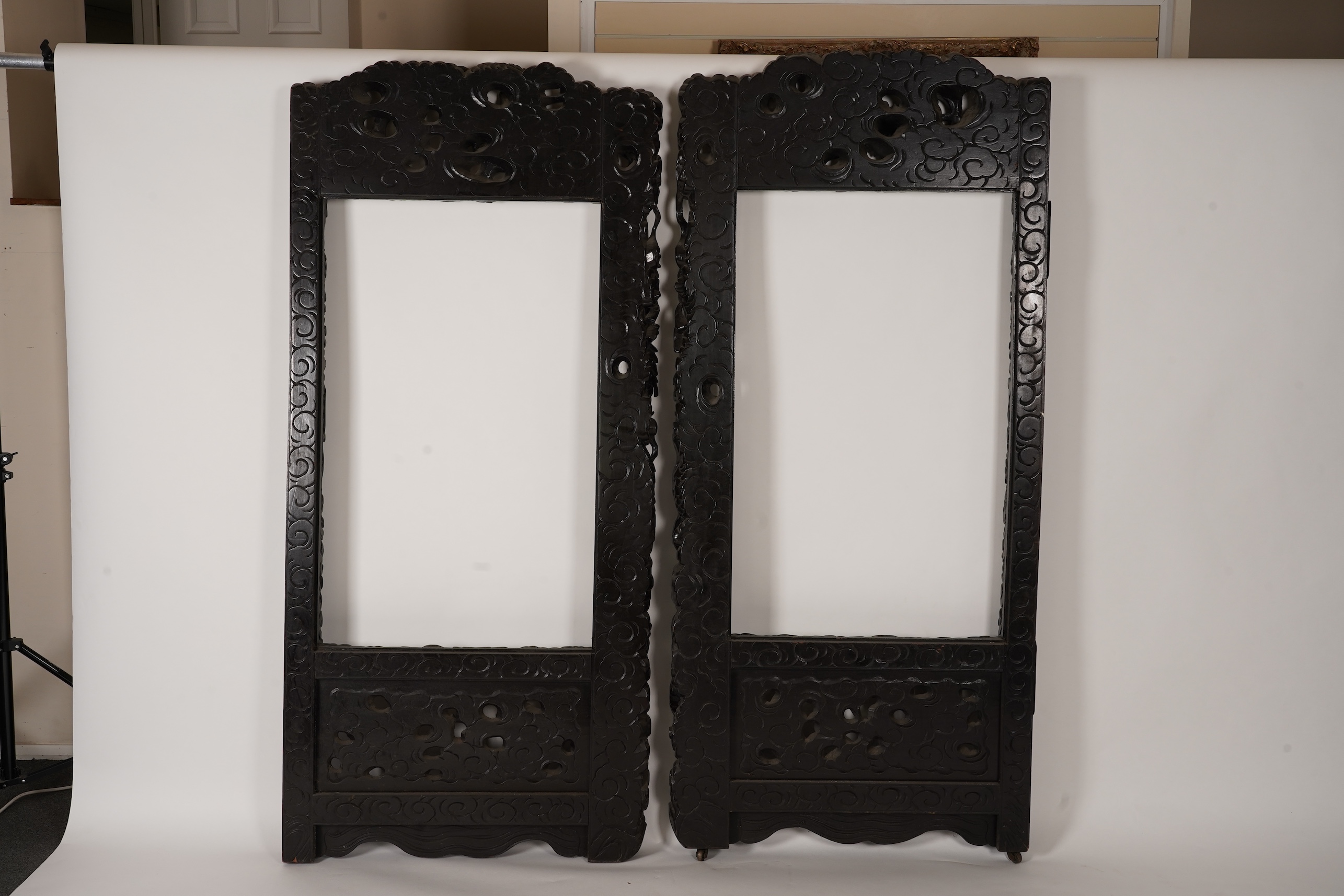 A pair of large Japanese carved hardwood ’dragon’ screen frames, Meiji period
